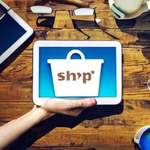 A person's hand holding an online Shopify store indicating assistance in building a Shopify store for your business.